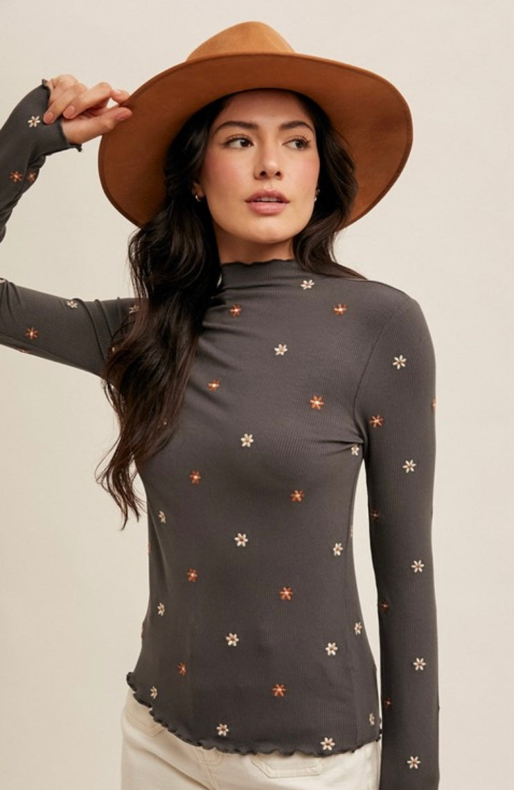Embroidered Rib Mock Neck Cabbage Hem Top