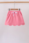 Deep pink scallop hem bow skort