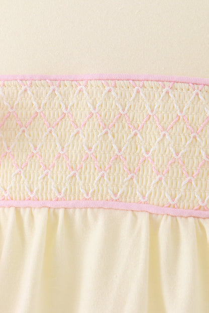 Cream smocked bow bubble