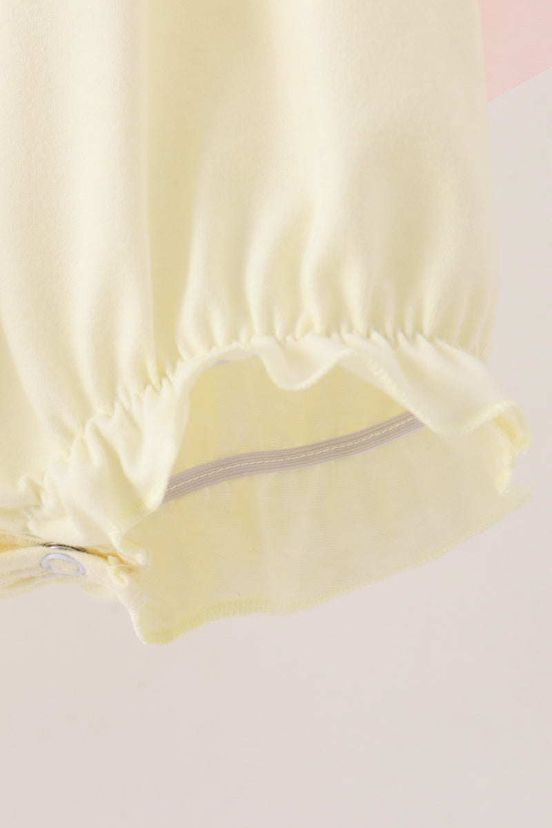 Cream smocked bow bubble