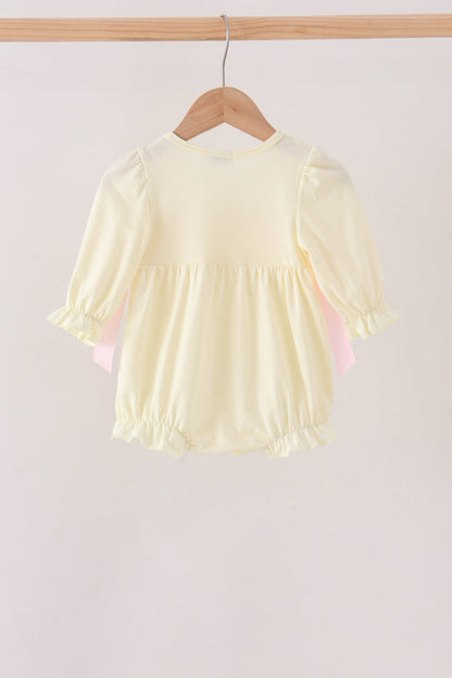 Cream smocked bow bubble
