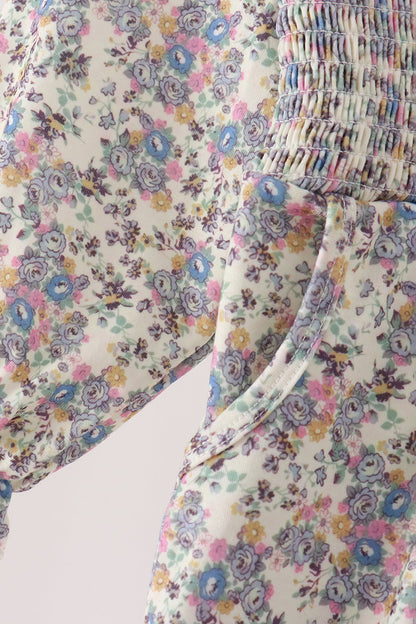 Blue floral smocked jumpsuit